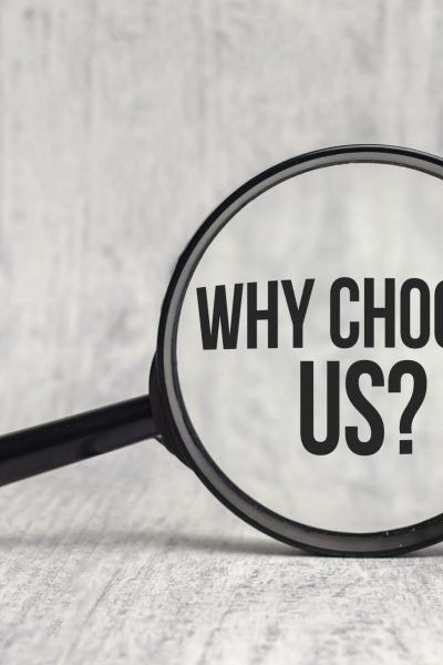 Why choose us on magnifying glass and white background